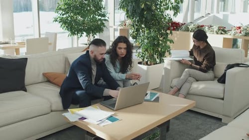 Business People Cooperating in Office Hall