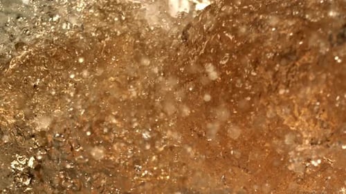 Close Up Water Flowing Over Rock