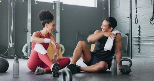 High five, fitness and happy man and women water drink after training workout in gym together