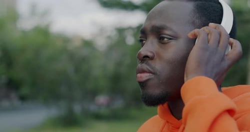 Young Adult Listening to Music With Headphones