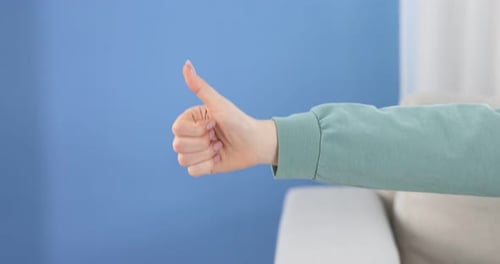 Hand Giving Thumbs Up and Thumbs Down
