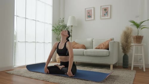 Woman Practicing Neck Stretches Yoga at Home