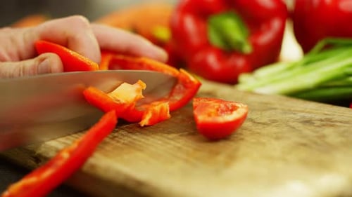 Chopping Red Pepper on Wooden Cutting Board