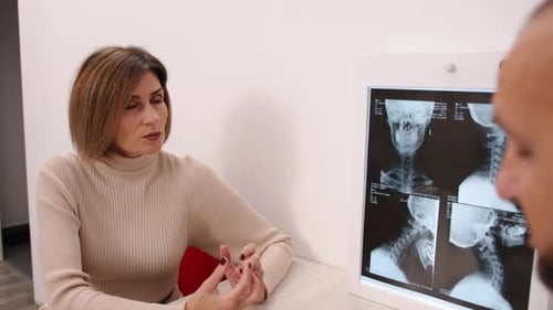Woman Talking to Doctor About Medical X-Ray