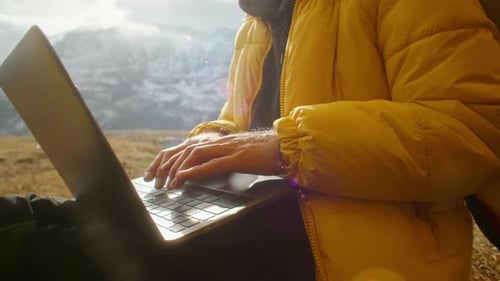 Enjoy Remote Work in Nature Using a Laptop While Surrounded By a Stunning Mountain View