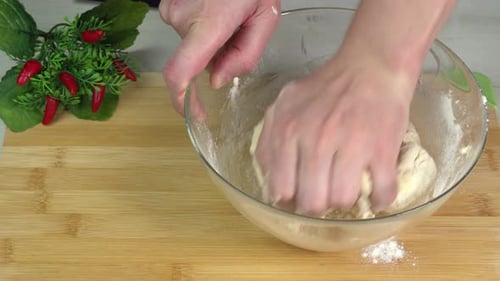 Hands Mixing Dough in Bowl for Cooking
