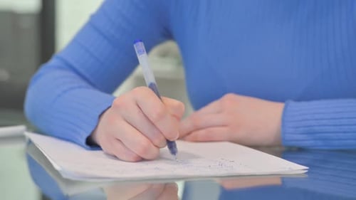 Close up of Woman Writing a Letter