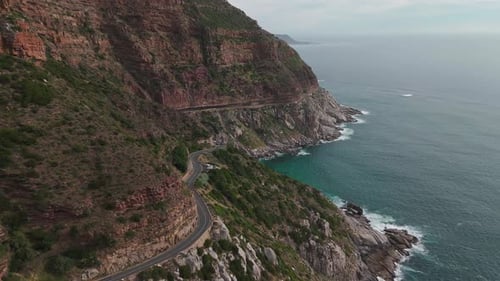 Beauty of a coastal road winding around a mountain