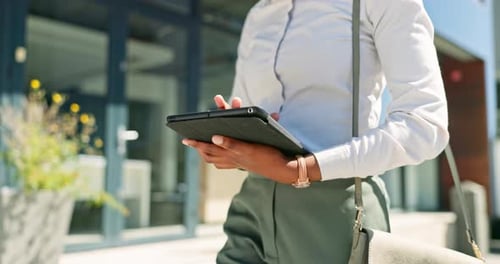 Digital tablet, walking and business woman in the city commuting to to the corporate office
