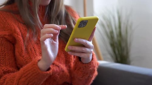 Woman Using Mobile Phone Indoors Close Up