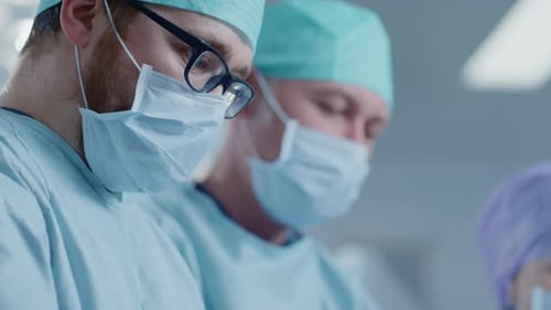 Surgeons Concentrating During Operation in Hospital Setting