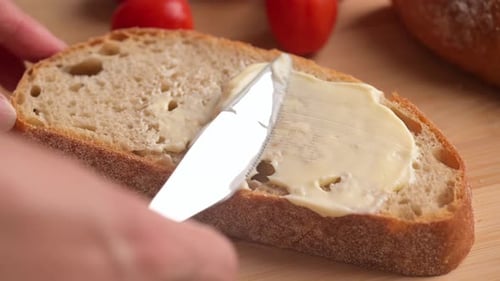 Spreading Butter on a Slice of Bread