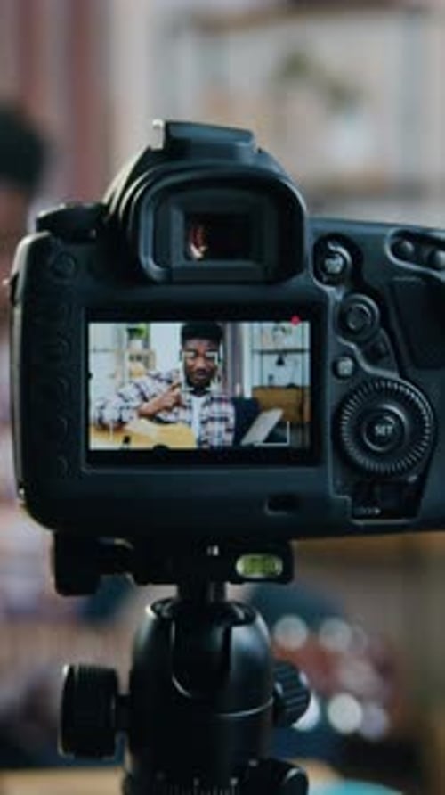 Camera Screen Shows Man Recording Himself in Home