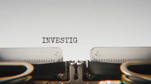 Old mechanical typewriter typing Investigation In Progress in a close-up view.