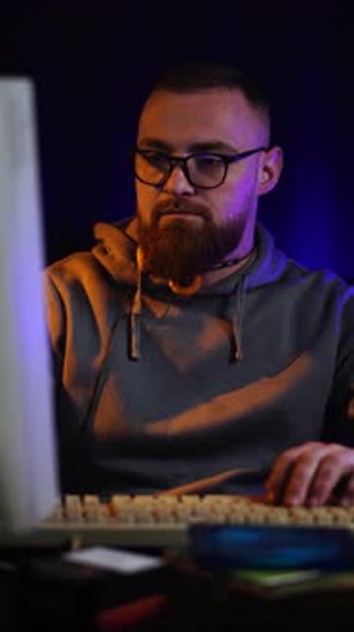 Vertical View, Programmer in Front of Monitor Screen and Desktop Computer From 1990's Working