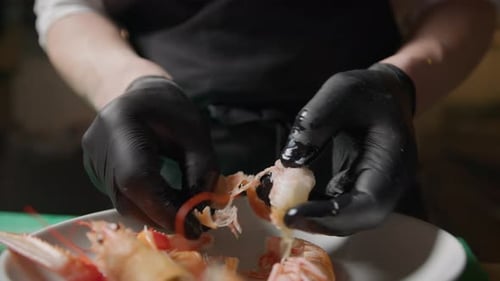 Chef Peeling Fresh Prawn in Kitchen Close Up