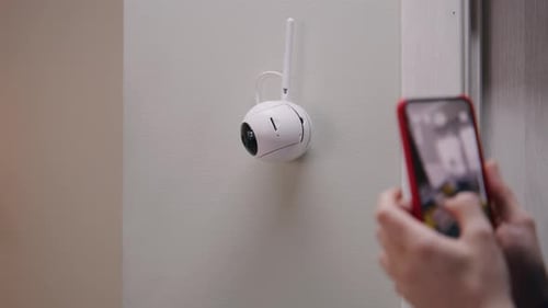 Woman Sets Up Security Camera with Phone