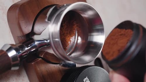 Ground Coffee Being Poured Into Filter Close Up