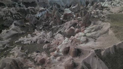 Ancient Rock Formations With Fairy Chimneys In Cappadocia, Central Turkey. Aerial Drone Shot