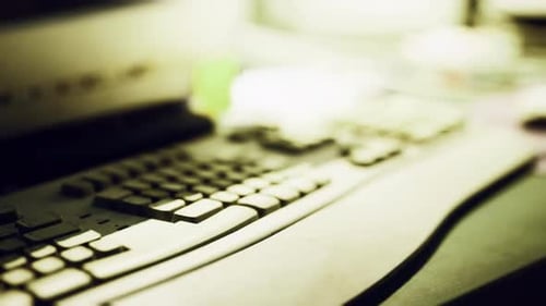Keyboard and Workspace Setup Highlighting Technology in a Dimly Lit Environment
