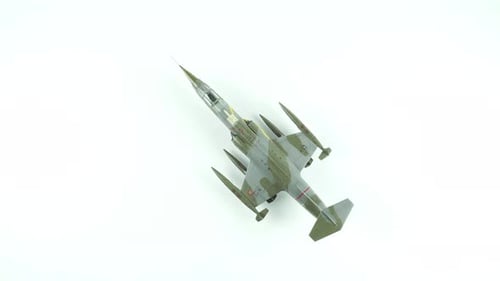 F 104 Starfighter Aircraft In Camouflage On White Background Top View.