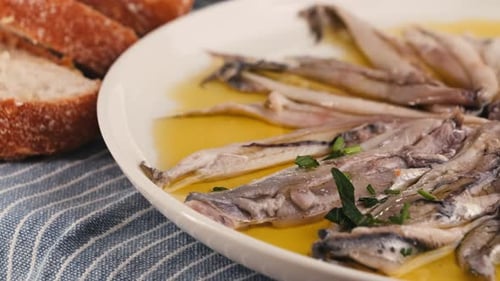 Fresh Sea Sardines and Anchovy Fish and Mullus On Display On Ice On Market Store Shop Seafood Fish