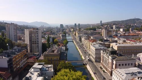 Cityscape Aerial View with River and Urban Buildings