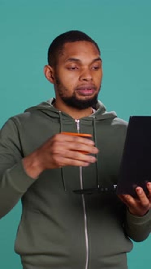 Vertical Video Man Adding Payment Method on Website Using Laptop