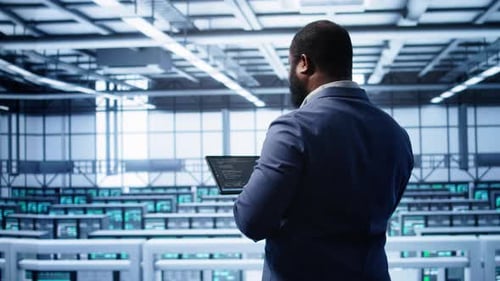 Engineer in Data Center Fixing Errors Affecting Server Rows Rigs