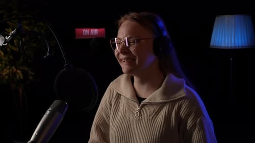 Beautiful Young Female Dj Speaks Into Microphone Records Podcast or Night News Show for Radio Close
