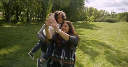 Happy Family Taking Selfie in Sunny Autumn Park 3034 Years