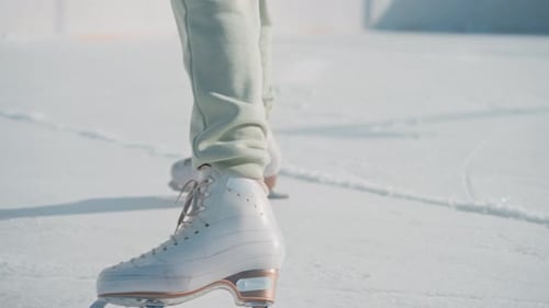 Enjoying Ice Skating on a Sunny Day at the Local Rink in Winter