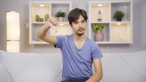 Man looking at camera with a negative expression.