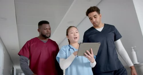 Medical professionals in a hospital corridor, with copy space