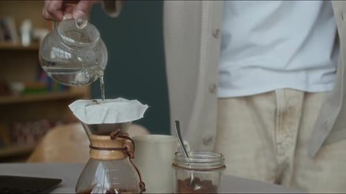 Person Preparing Pour Over Coffee at Home