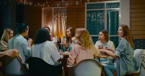 Family and Friends Celebrate Birthday Outdoors at Night