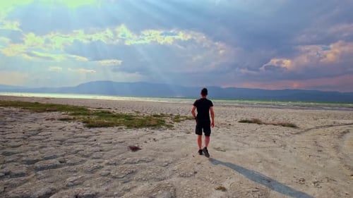 Walking Man by the Dried Lake