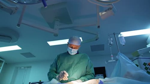 Surgeons Performing Operation in Brightly Lit Operating Room