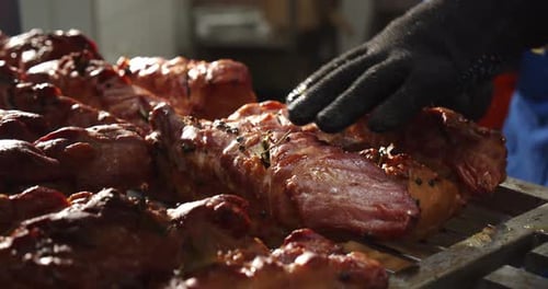 Seasoned Pork Meat Being Prepared in Commercial Kitchen
