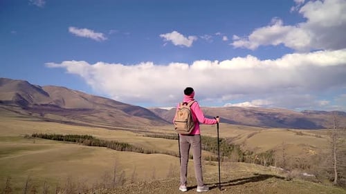 Hiker Tourist Traveler Woman Climbing Top Mountain Sunset Hiking Poles at Travel Tourism Nature