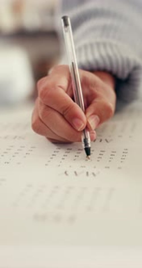 Hand Circles Date on Calendar with Pen, Planning