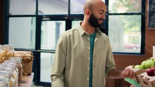 Man shops for fresh fruits and groceries
