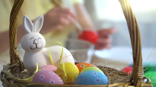 Easter Basket with Colorful Painted Eggs Bunny