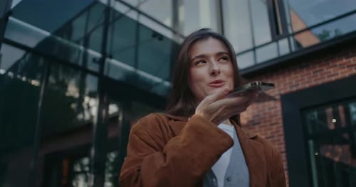 Woman Uses Voice Assistant on Mobile Phone