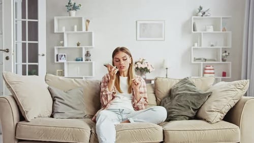 Woman Using Voice Memo App on Smartphone