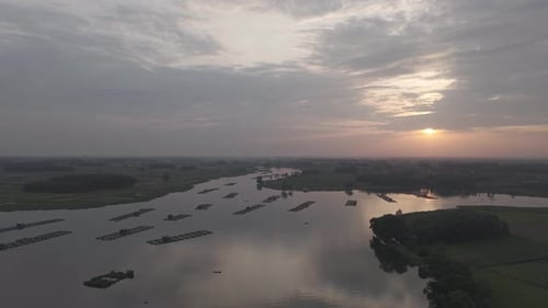 Aerial View Of River With Boats At Sunset