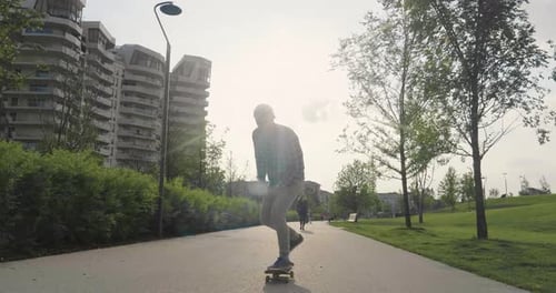 A boy practices skateboarding in the middle of the city, between buildings and skyscrapers. Concep