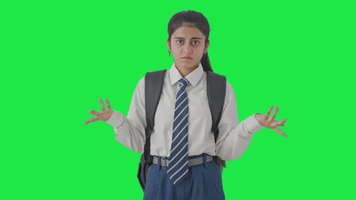 Confused Indian school girl asking what question Green screen