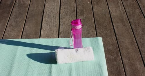 Yoga Mat with Towel and Water Bottle Outdoors