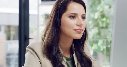 4k video footage of a call centre agent sitting at her desk